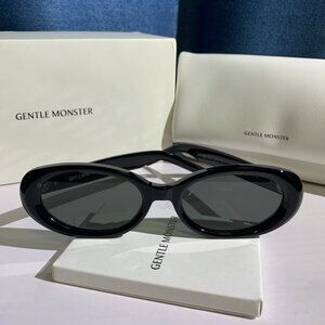 Black Oval Sunglasses with Dark Lenses